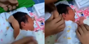 Terlalu Gemesin, Bayi yang Nangis Gara-Gara Jambak Rambutnya Sendiri Ini Curi Perhatian Netizen